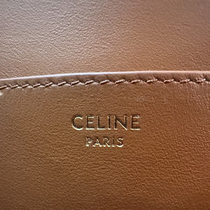 CELINE CLUTCH ON STRAP TABOU IN TRIOMPHE CANVAS AND CALFSKIN