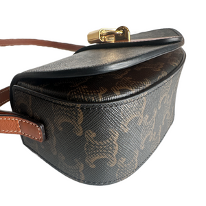 CELINE CLUTCH ON STRAP TABOU IN TRIOMPHE CANVAS AND CALFSKIN