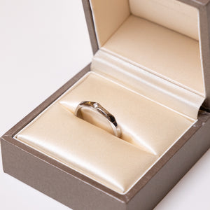 BVLGARI INFINITO WEDDING BAND IN PLATINUM SET WITH ONE DIAMOND